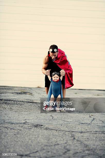 learning to fly - baby superhero stock pictures, royalty-free photos & images