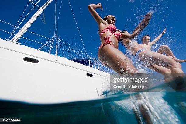 saltare in mare - jumping of boat foto e immagini stock
