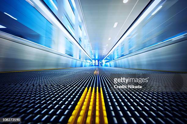moving walkway at the airport - travolator stock pictures, royalty-free photos & images