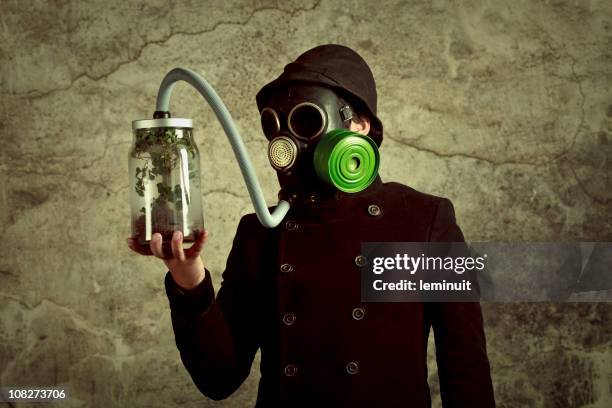 man breathing from the last tree of earth - air respirator mask stock pictures, royalty-free photos & images