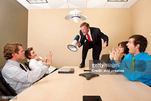 crazy boss yelling at employees - bot stockfoto's en -beelden