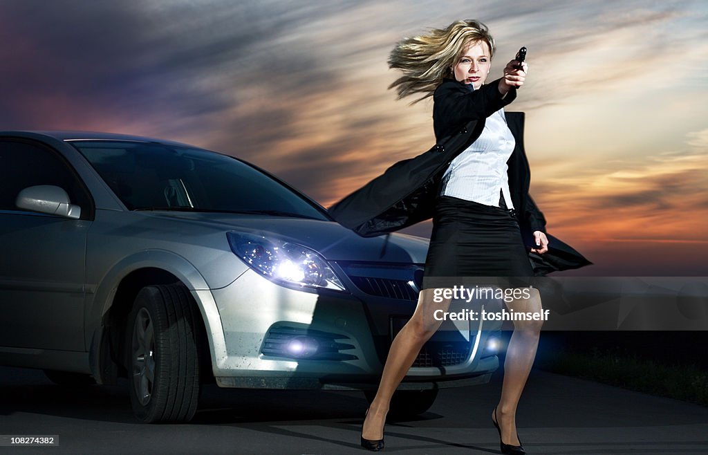 Criminal Woman against a Car