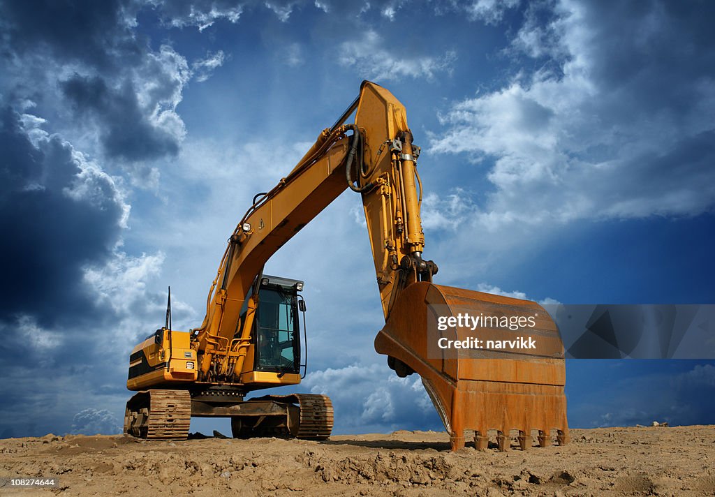 Yellow Excavator at Construction Site