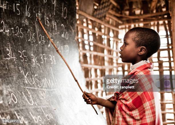 african child learning numbers at school - tanzania bildbanksfoton och bilder