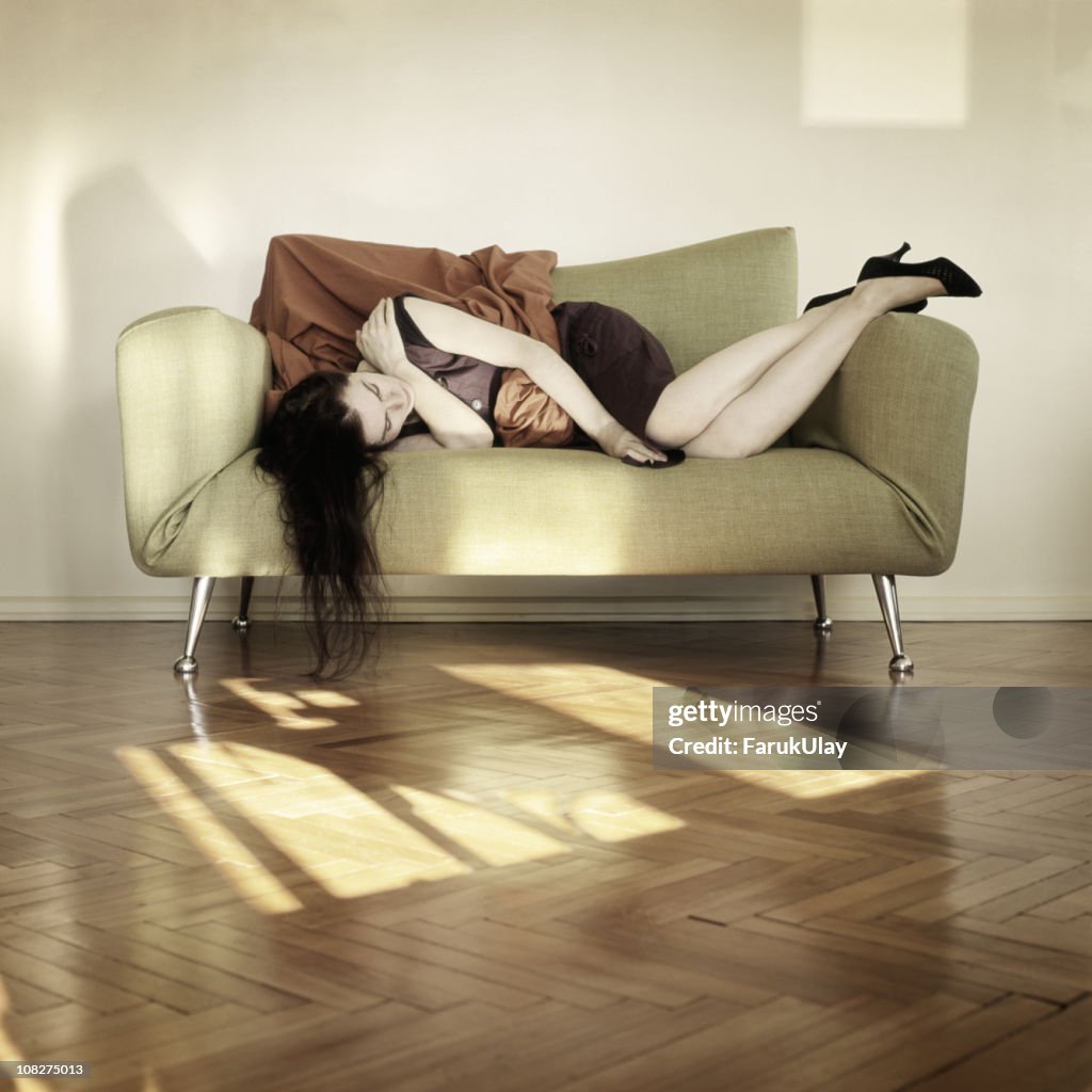 Young Woman Asleep on Sofa