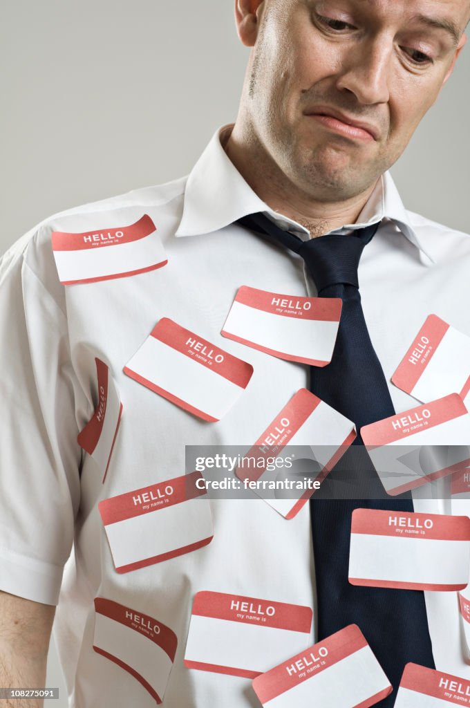 Businessman Wearing Label Stickers