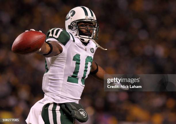 Santonio Holmes of the New York Jets celebrates after he scored a third quarter touchdown against the Pittsburgh Steelers during the 2011 AFC...