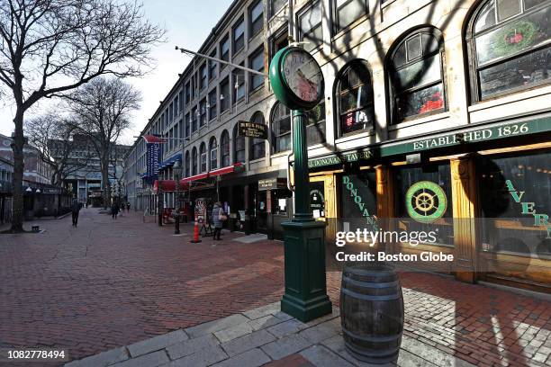 Storefronts at the Faneuil Hall Marketplace in Boston are pictured on Jan. 7, 2019. Today, surrounded by change, Faneuil Hall feels frozen in time....