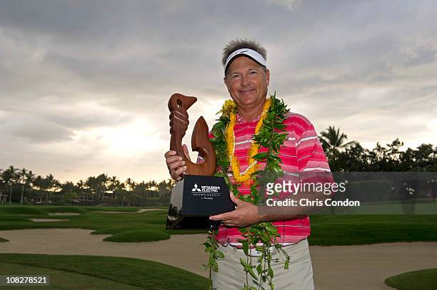 John Cook poses with the tournament trophy after winning the Mitsubishi Electric Championship at Hualalai Golf Club on January 23, 2011 in...