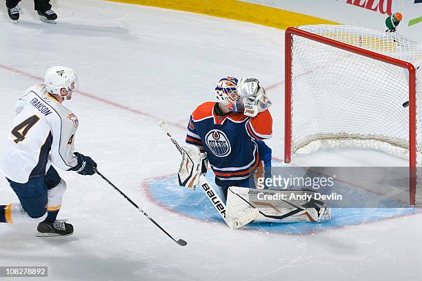Cody Franson of the Nashville Predators puts the game winning shoot-out goal past Devan Dubnyk of the Edmonton Oilers at Rexall Place on January 23,...