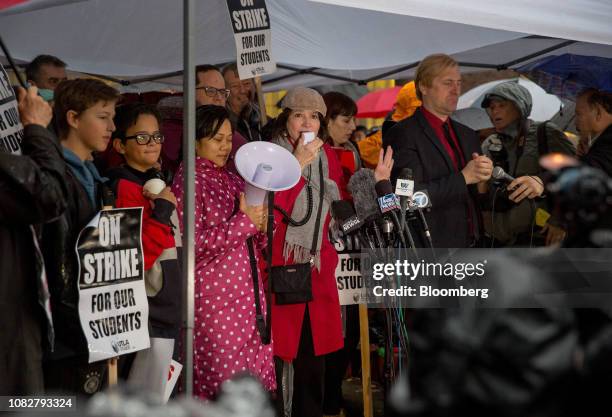 Lily Eskelsen Garca, president of the National Education Association, center, speaks during a teachers strike rally outside of John Marshall High...