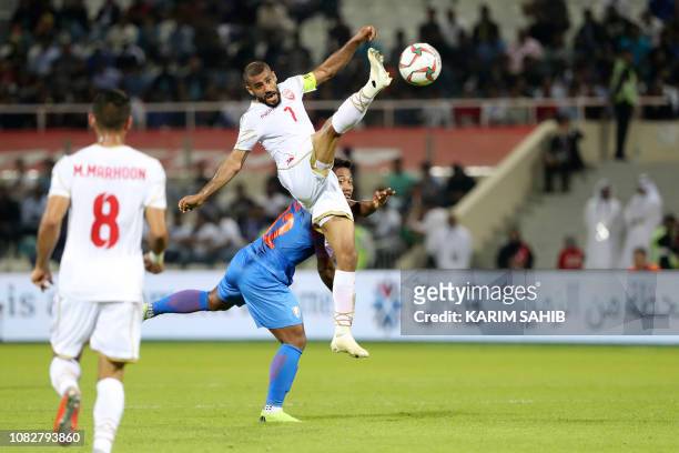 India's forward Jeje Lalpekhlua fights for the ball with Bahrain's midfielder Abdulwahab Al Safi during the 2019 AFC Asian Cup group A football match...