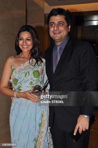 Indian Bollywood actress Sonali Bendre and her husband, film producer and director, Goldie Behl attend the Mijwan Welfare Society "Sonnets In Fabric"...