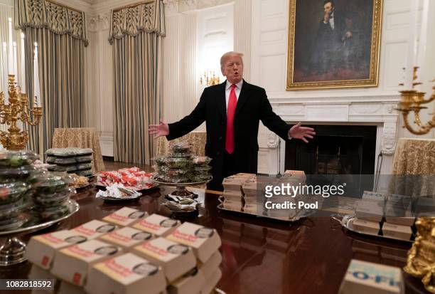 President Donald Trump presents fast food to be served to the Clemson Tigers football team to celebrate their Championship at the White House on...