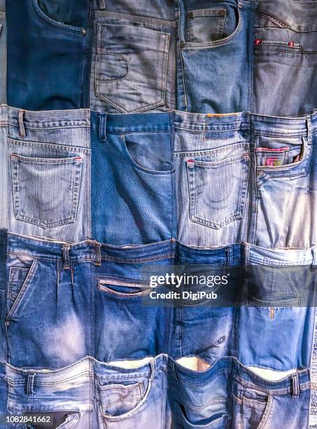 wall pockets made of recycled denim jeans - vestito denim foto e immagini stock