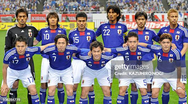 Japan's starting players pose in a photo session prior to their international friendly football match against South Korea at Saitama Stadium,...