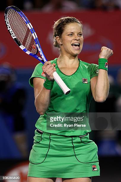 Kim Clijsters of Belgium celebrates winning match point in her fourth round match against Ekaterina Makarova of Russia during day eight of the 2011...