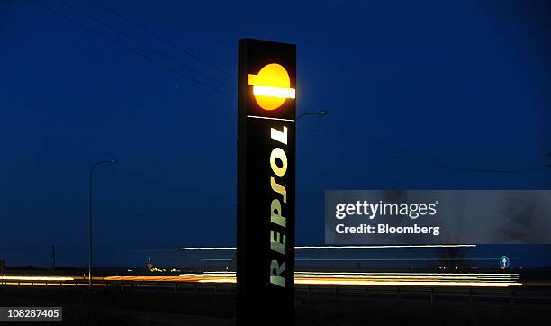 The logo of Repsol YPF SA stands on display outside a gas station on the A4 road in Tembleque, Spain, on Saturday, Jan. 22, 2011. Repsol YPF SA,...