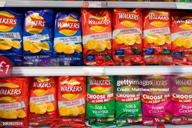 Multiple bags of Walkers crisps on display in a supermarket on September 21, 2017 in Cardiff, United Kingdom.