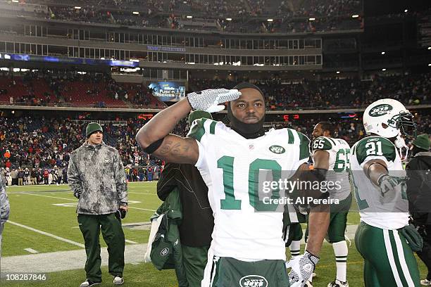 Wide Receiver Santonio Holmes of the New York Jets celebrates a victory against the New England Patriots in the Divisional Playoff Game at Gillette...