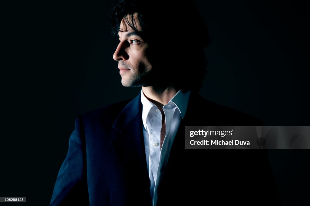 Portrait of a businessman on a black background