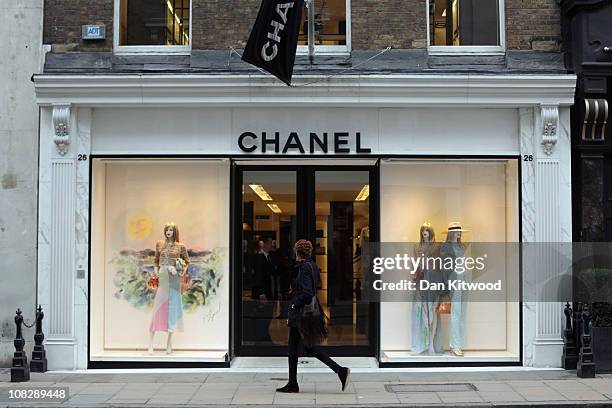 Person walks by the Chanel store on Bond Street on January 24, 2011 in London, England. Despite the expected retail slump, sales of luxury goods are...