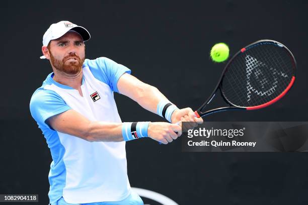 Bjorn Fratangelo of the United States plays a backhand in his first round match against Gilles Simon of France during day two of the 2019 Australian...