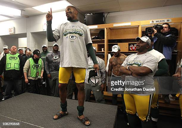 Charles Woodson of the Green Bay Packers talks to his team after the Packers 21-14 victory against the Chicago Bears in the NFC Championship Game at...
