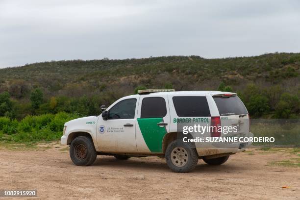 United States border patrol car drives near the Rio Grande in Laredo, Texas, on January 14, 2019. - Mexico is just minutes away on foot, the time it...