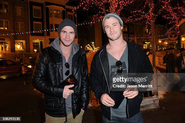 Actors Liam Hemsworth and Chris Hemsworth check out the new Samsung Galaxy Tab at the Samsung Galaxy Tab Lift on January 22, 2011 in Park City, Utah.
