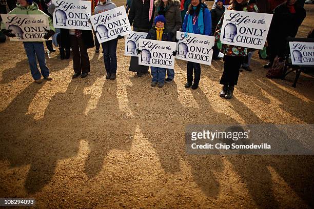 Members of St. Patrick's Catholic Church in Kathleen, Georgia, stand together during an anti-abortion rally ahead of the March for Life on the...