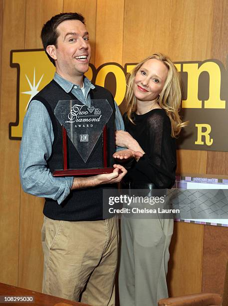 Actors Ed Helms and Anne Heche at "Cedar Rapids" cast photos on January 24, 2011 in Park City, Utah.