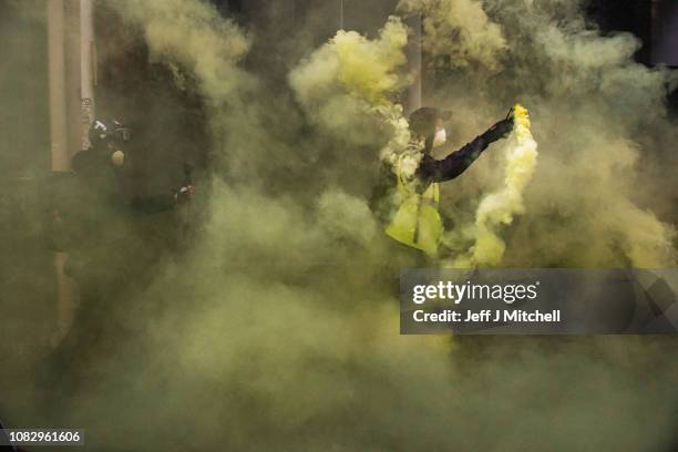 Protesters let off flares near Les Halles during the 'yellow vests' demonstration on December 15, 2018 in Paris, France. The protesters gathered in...