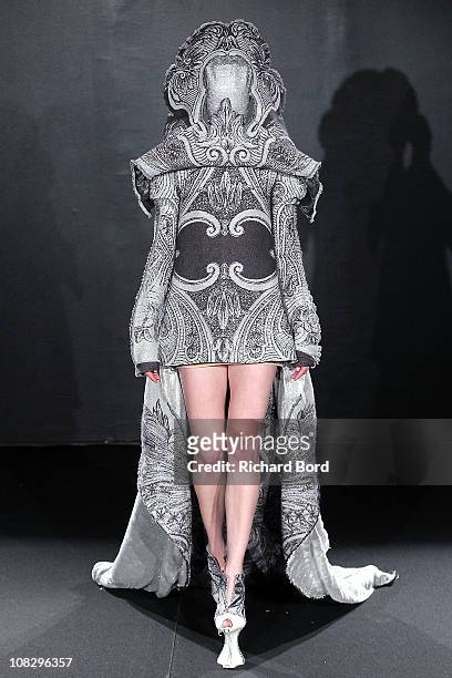Model walks the runway during the Jantaminiau show as part of the Paris Haute Couture Fashion Week Spring/Summer 2011 at Le Laboratoire on January...