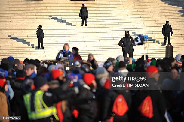 Hundreds of people participate in the annual March for Life as the pass the US Supreme Court with Court Police officers guarding the front steps on...