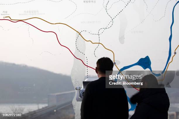 Visitors look towards the north side of the border from the Imjingak pavilion near the Demilitarized Zone in Paju, South Korea, on Sunday, Jan. 13,...