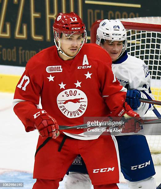 Liam Ham of the Mississauga Steelheads battles with Keeghan Howdeshell of the Sault Ste. Marie Greyhounds during OHL game action on December 14, 2018...