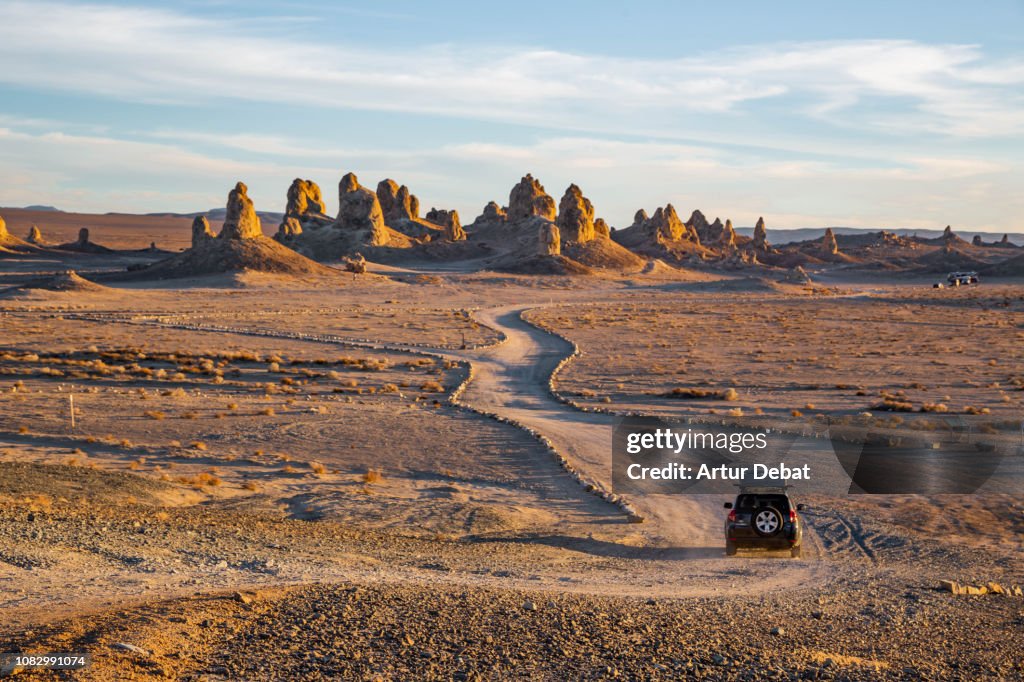 Driving through the rock formations of Trona Pinnacles in the California desert.
