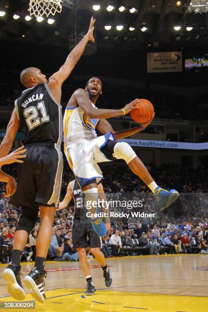 Dorell Wright of the Golden State Warriors scores inside against the San Antonio Spurs on January 24, 2011 at Oracle Arena in Oakland, California....