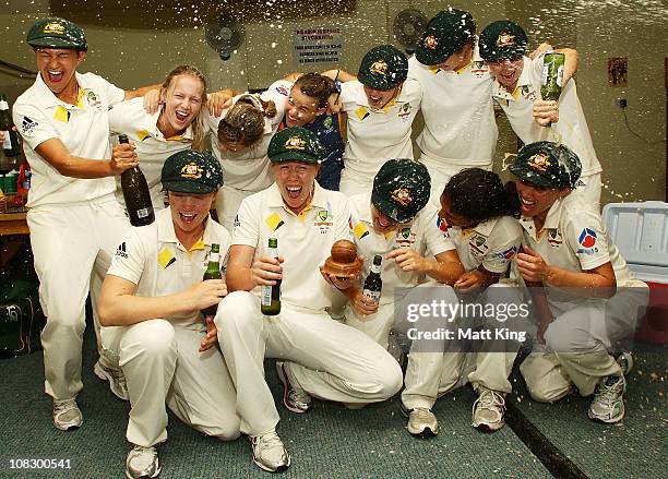 The Australian team pose with the Ashes trophy after winning the match during day four of the Women's CBA Test match between Australia and England at...