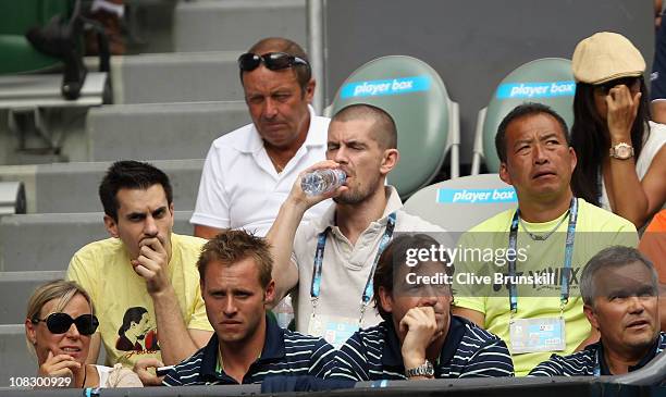 The parents of Caroline Wozniacki of Denmark, Anna Wozniacki and Piotr Wozniacki watch her match against Francesca Schiavone of Italy during day nine...