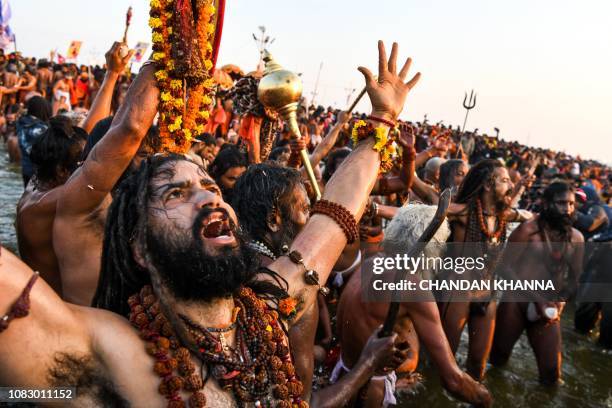 Graphic content / TOPSHOT - Indian naked sadhus take a dip in the water of the holy Sangam -- the confluence of the Ganges, Yamuna and mythical...