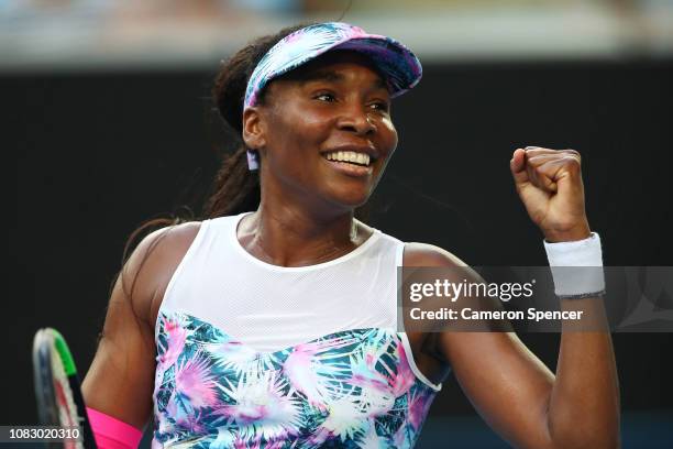 Venus Williams of the United States celebrates after winning match point in her first round match against Mihaela Buzarnescu of Romania during day...