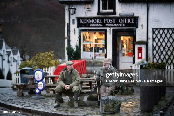 Anglers waiting in the village before the opening of the salmon fishing on the River Tay in Kenmore, near Aberfeldy.