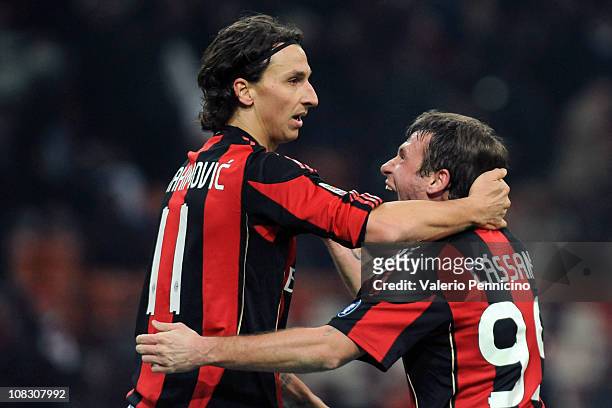 Zlatan Ibrahimovic of AC Milan celebrates after scoring the opening goal with team-mate Antonio Cassano during the Serie A match between AC Milan and...