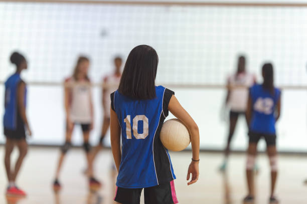 getting ready for a match - girls volleyball stock pictures, royalty-free photos & images
