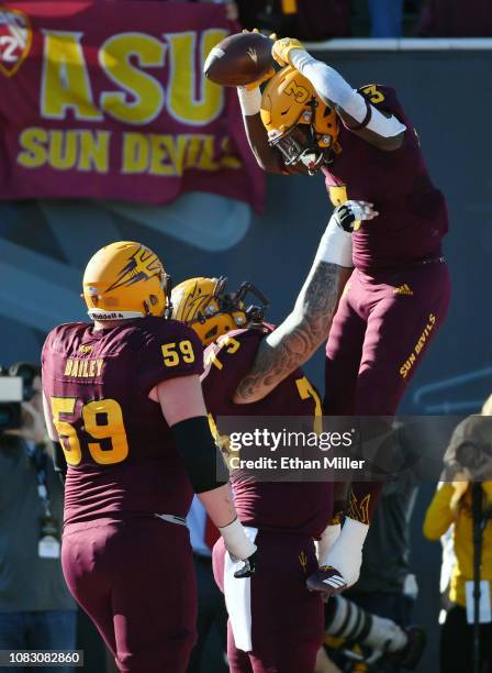 Running back Eno Benjamin and offensive lineman Cohl Cabral of the Arizona State Sun Devils celebrate after Benjamin ran for a touchdown against the...