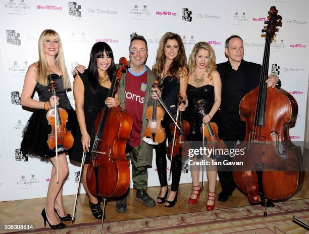 Musician Nigel Kennedy poses in the press room with the band Bond at the South Bank Sky Arts Awards at The Dorchester on January 25, 2011 in London,...