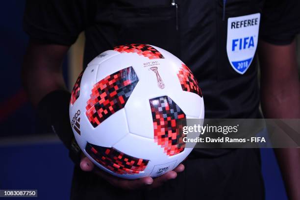 Referee holds the official match ball as he walks through the tunnel during the FIFA Club World Cup UAE 2018 second round match between Kashima...