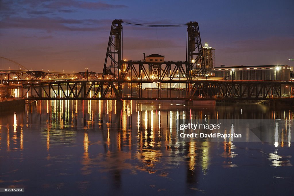 Dusk shot of river, drawbridge, industry